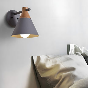 A modern wall light with a vibrant multi-color cone design, perfect for bedrooms and living rooms.