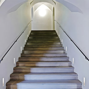 Modern embedded LED wall light providing soft, energy-efficient lighting for stairs.