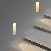 Frameless LED wall light designed for modern staircases, offering efficient lighting.