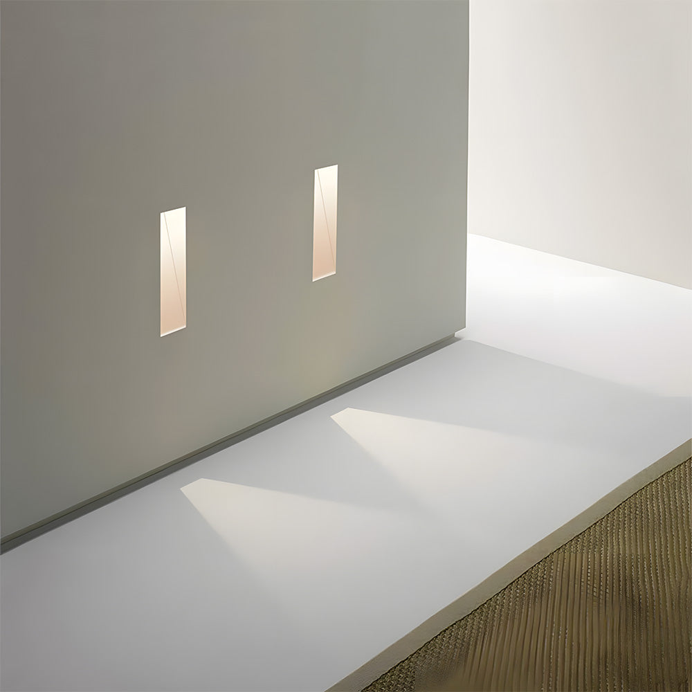 A frameless LED wall light providing modern lighting for staircases and hallways.